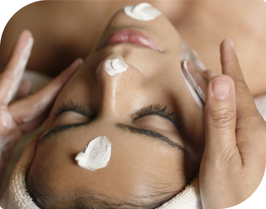 Woman enjoying the Ultimate Facial Experience at Facials & Skincare by Debbie, Orange, CA