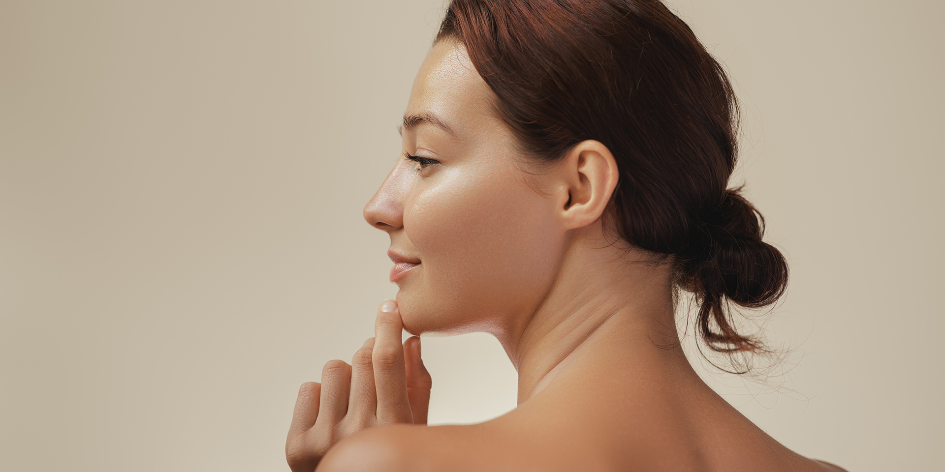 Profile view of a woman with radiant skin after visiting the best esthetician in Orange, CA